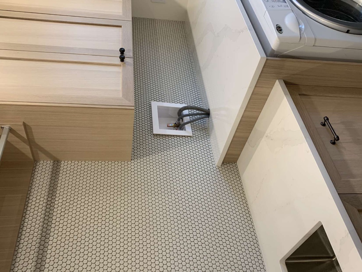 Penny-round mosaic floor in a laundry room