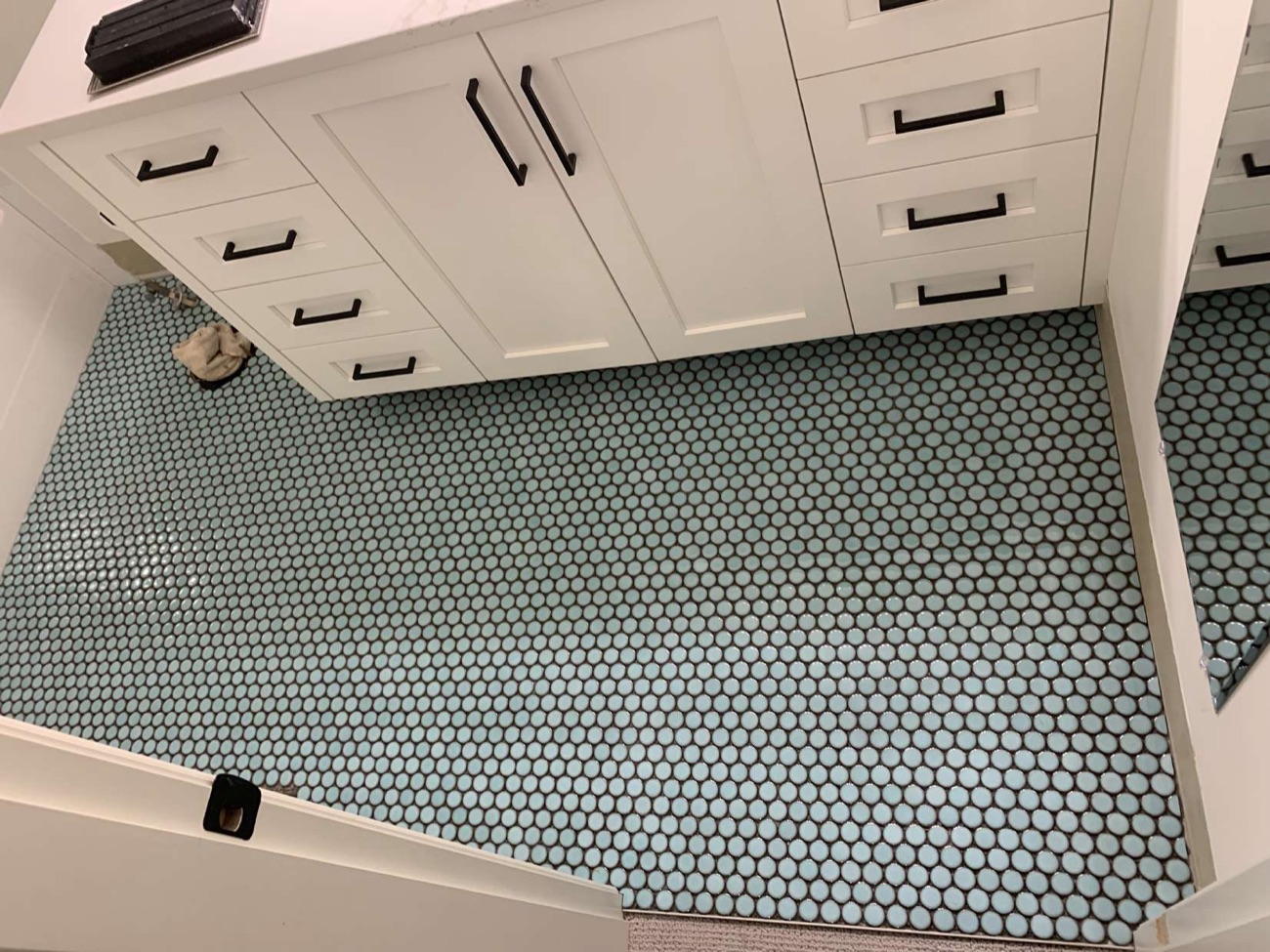Penny-round mosaic tile floor