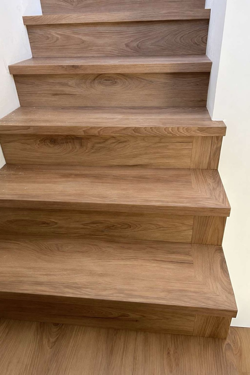 Wood-look engineered flooring installed on a staircase